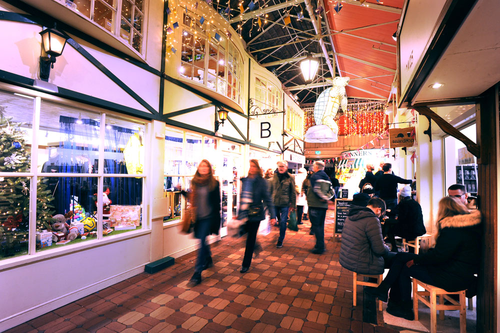 People shopping and socialising in Oxford Covered Market