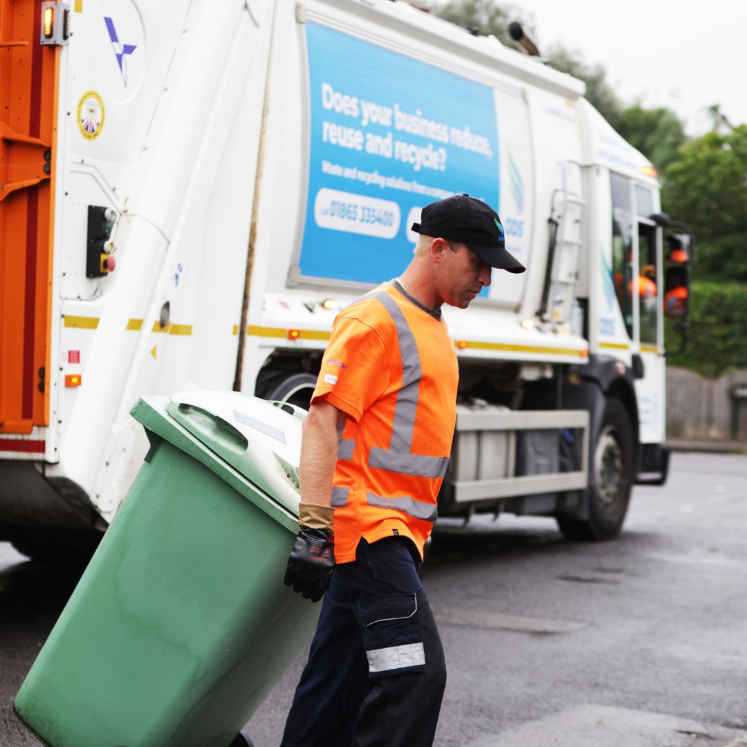 ODS employee collects household bins