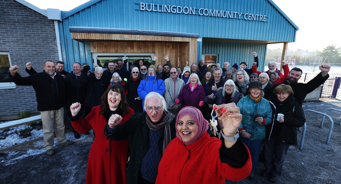 A picture of local residents, councillors and council officers celebrating outside the newly-completed Bullingdon Community Centre in December 2022