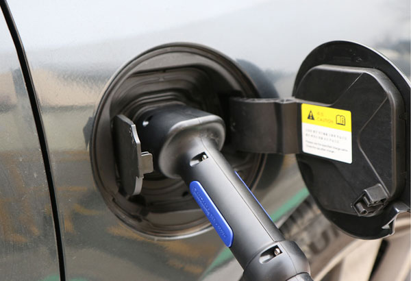 Electric vehicle charger in vehicle