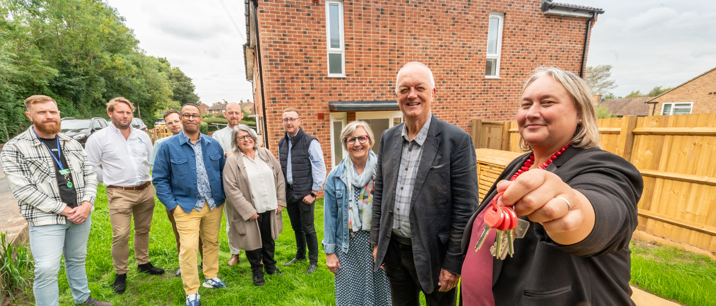 Celebrating the completion of an OX Place project in Foxwell Drive