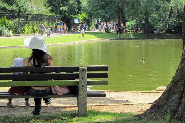 People sitting on bench in Hinksey Park