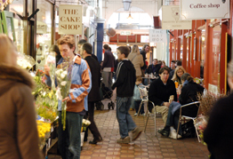 People shopping and socialising in Oxford Covered Market