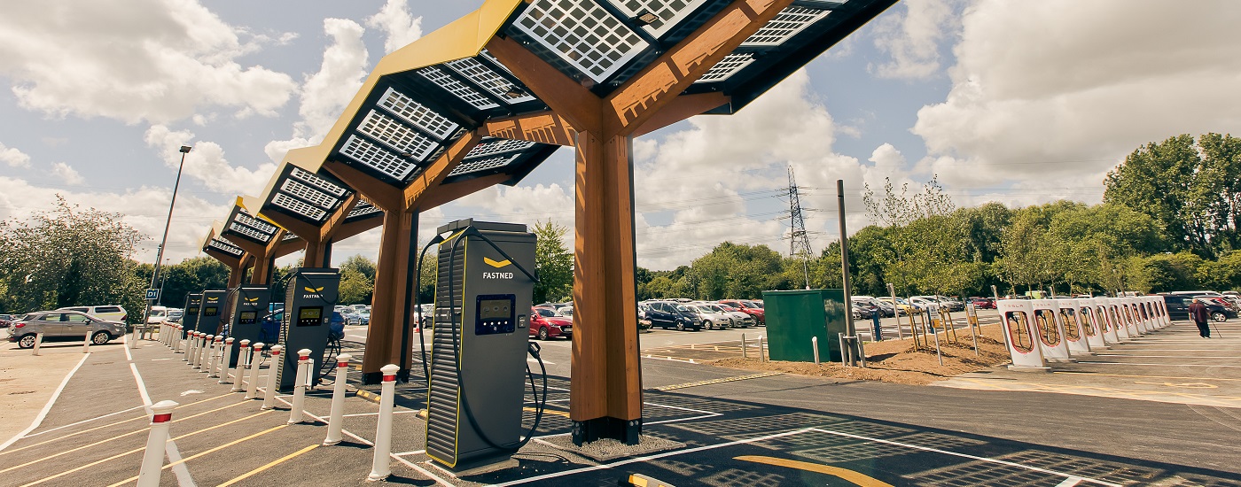 Image showing the Oxford Energy Superhub at Redbridge Park and Ride, including electric vehicle charging points and a yellow, zigzag-shaped canopy
