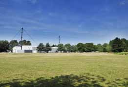 View over green space towards Oxford Ice Rink