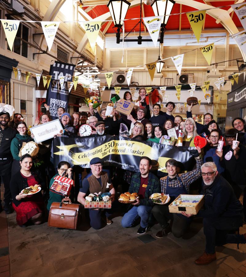 Covered Market traders celebrate 250 years of the market by holding new bunting, banners and products