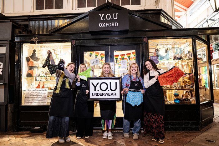 YOU underwear team in front of shop