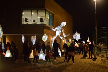 lantern parade with giant dancing man lantern